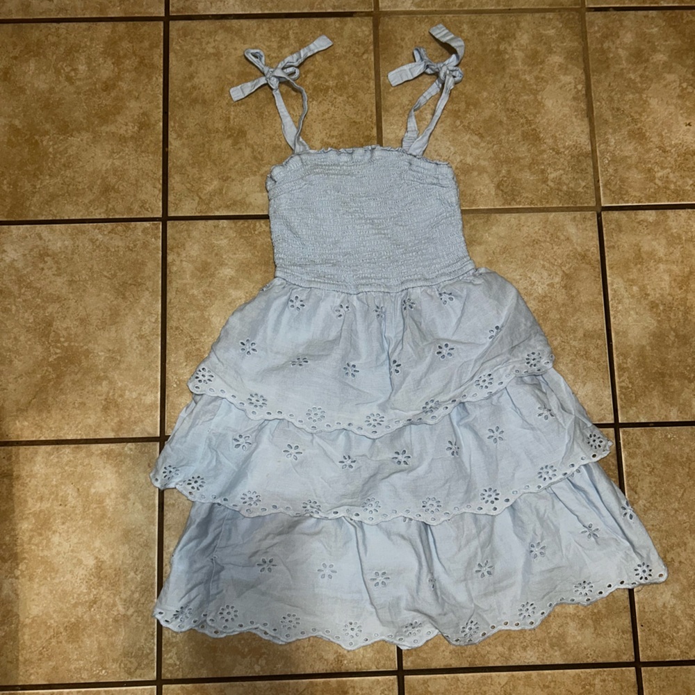 This is a Sincerely Jules tie-strap eyelet dress in light blue size small
